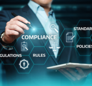 A man with a touch screen pointing to compliance A man with a touch screen pointing to compliance